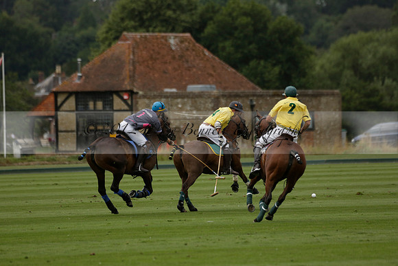 La Tremenda (lilac) v Maiz Dulce (yellow) in a Brecknock Cup polo match played on Lawns 1 at the Cowdray Park Polo Club on Tuesday 13 August 2013