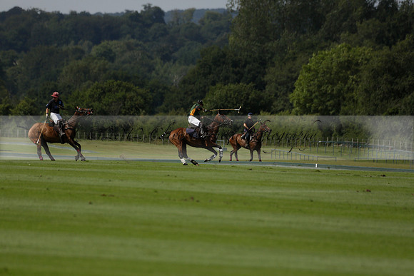 Maiz Dulce (green) v River (blue) in a Uber Polo Midsummer 12 goal polo match on Wednesday 21 August 2013 at Cowdray park Polo Club on Ambersham 2.  www.polopictures.co.uk