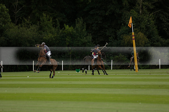 La Tremenda (lilac) v Maiz Dulce (yellow) in a Brecknock Cup polo match played on Lawns 1 at the Cowdray Park Polo Club on Tuesday 13 August 2013
