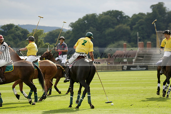 La Tremenda (lilac) v Maiz Dulce (yellow) in a Brecknock Cup polo match played on Lawns 1 at the Cowdray Park Polo Club on Tuesday 13 August 2013