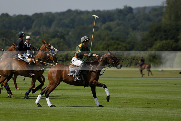Maiz Dulce (green) v River (blue) in a Uber Polo Midsummer 12 goal polo match on Wednesday 21 August 2013 at Cowdray park Polo Club on Ambersham 2.  www.polopictures.co.uk