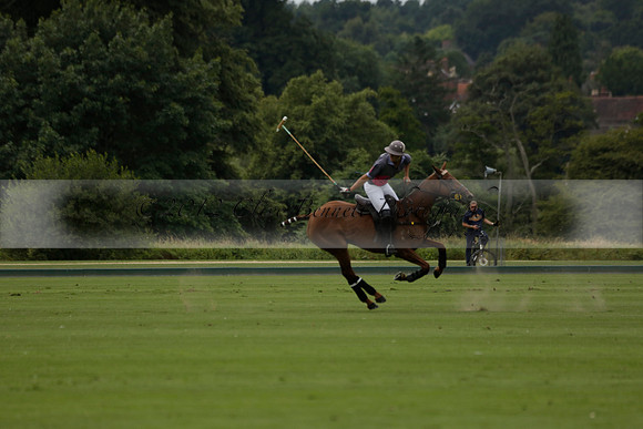 La Tremenda (lilac) v Maiz Dulce (yellow) in a Brecknock Cup polo match played on Lawns 1 at the Cowdray Park Polo Club on Tuesday 13 August 2013