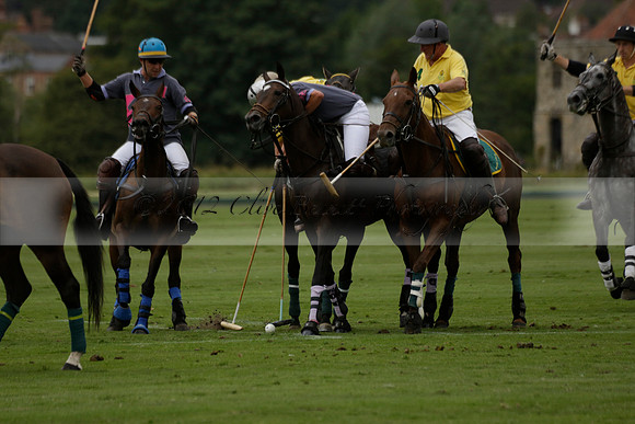 La Tremenda (lilac) v Maiz Dulce (yellow) in a Brecknock Cup polo match played on Lawns 1 at the Cowdray Park Polo Club on Tuesday 13 August 2013