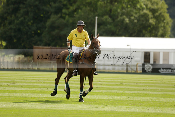 La Tremenda (lilac) v Maiz Dulce (yellow) in a Brecknock Cup polo match played on Lawns 1 at the Cowdray Park Polo Club on Tuesday 13 August 2013