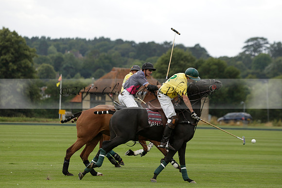 La Tremenda (lilac) v Maiz Dulce (yellow) in a Brecknock Cup polo match played on Lawns 1 at the Cowdray Park Polo Club on Tuesday 13 August 2013