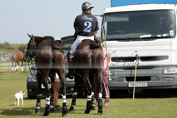 Maiz Dulce (green) v River (blue) in a Uber Polo Midsummer 12 goal polo match on Wednesday 21 August 2013 at Cowdray park Polo Club on Ambersham 2.  www.polopictures.co.uk