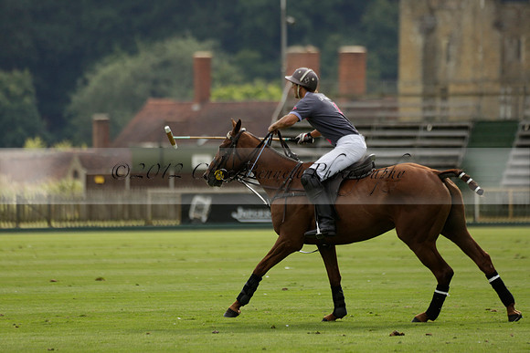 La Tremenda (lilac) v Maiz Dulce (yellow) in a Brecknock Cup polo match played on Lawns 1 at the Cowdray Park Polo Club on Tuesday 13 August 2013
