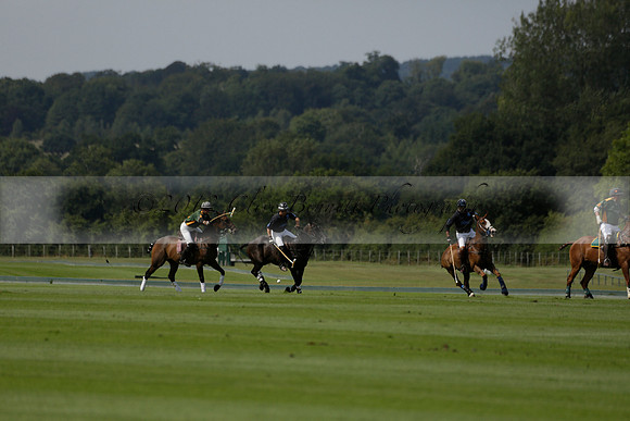 Maiz Dulce (green) v River (blue) in a Uber Polo Midsummer 12 goal polo match on Wednesday 21 August 2013 at Cowdray park Polo Club on Ambersham 2.  www.polopictures.co.uk