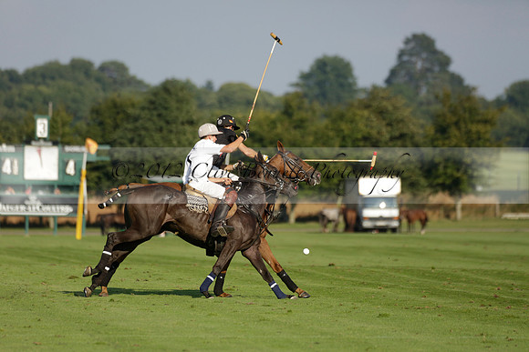 Pluma Negra (white) v Shoreline (black) in the Brecknock Cup Subsidiary final polo match played on Sunday 25 August 2013 at Cowdray Park Polo Club on Ambersham 1. 2013.10.12 www.polopictures.co.uk