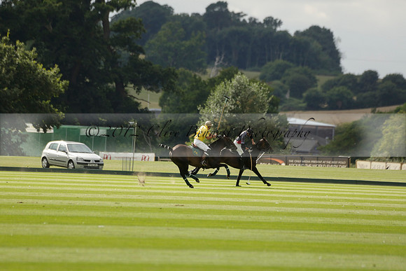 La Tremenda (lilac) v Maiz Dulce (yellow) in a Brecknock Cup polo match played on Lawns 1 at the Cowdray Park Polo Club on Tuesday 13 August 2013