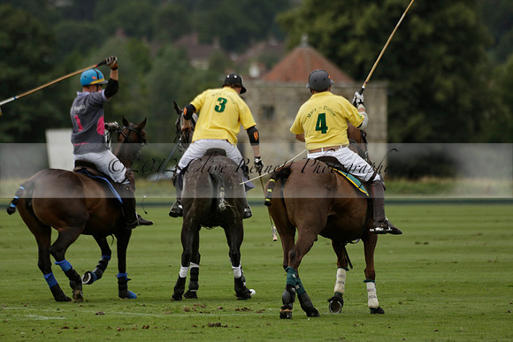 La Tremenda (lilac) v Maiz Dulce (yellow) in a Brecknock Cup polo match played on Lawns 1 at the Cowdray Park Polo Club on Tuesday 13 August 2013