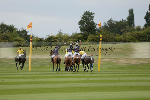 La Tremenda (lilac) v Maiz Dulce (yellow) in a Brecknock Cup polo match played on Lawns 1 at the Cowdray Park Polo Club on Tuesday 13 August 2013