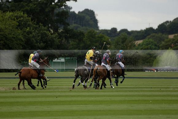 La Tremenda (lilac) v Maiz Dulce (yellow) in a Brecknock Cup polo match played on Lawns 1 at the Cowdray Park Polo Club on Tuesday 13 August 2013