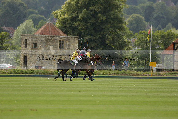 La Tremenda (lilac) v Maiz Dulce (yellow) in a Brecknock Cup polo match played on Lawns 1 at the Cowdray Park Polo Club on Tuesday 13 August 2013