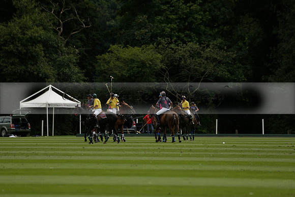 La Tremenda (lilac) v Maiz Dulce (yellow) in a Brecknock Cup polo match played on Lawns 1 at the Cowdray Park Polo Club on Tuesday 13 August 2013