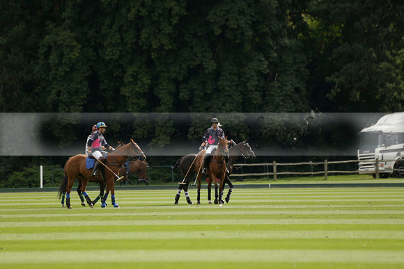 La Tremenda (lilac) v Maiz Dulce (yellow) in a Brecknock Cup polo match played on Lawns 1 at the Cowdray Park Polo Club on Tuesday 13 August 2013