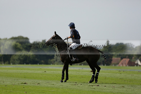 Maiz Dulce (green) v River (blue) in a Uber Polo Midsummer 12 goal polo match on Wednesday 21 August 2013 at Cowdray park Polo Club on Ambersham 2.  www.polopictures.co.uk
