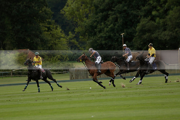 La Tremenda (lilac) v Maiz Dulce (yellow) in a Brecknock Cup polo match played on Lawns 1 at the Cowdray Park Polo Club on Tuesday 13 August 2013