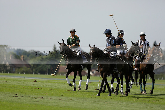 Maiz Dulce (green) v River (blue) in a Uber Polo Midsummer 12 goal polo match on Wednesday 21 August 2013 at Cowdray park Polo Club on Ambersham 2.  www.polopictures.co.uk