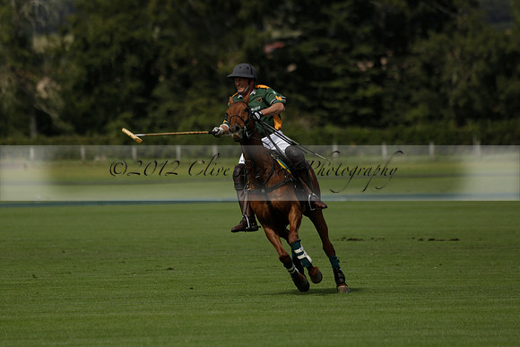 Maiz Dulce (green) v River (blue) in a Uber Polo Midsummer 12 goal polo match on Wednesday 21 August 2013 at Cowdray park Polo Club on Ambersham 2.  www.polopictures.co.uk