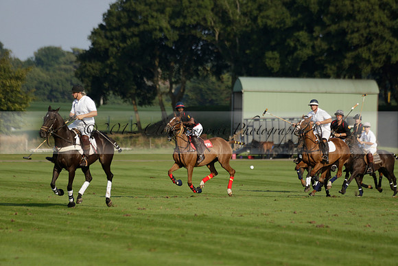 Pluma Negra (white) v Shoreline (black) in the Brecknock Cup Subsidiary final polo match played on Sunday 25 August 2013 at Cowdray Park Polo Club on Ambersham 1. 2013.10.12 www.polopictures.co.uk