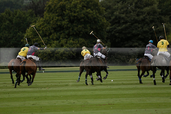 La Tremenda (lilac) v Maiz Dulce (yellow) in a Brecknock Cup polo match played on Lawns 1 at the Cowdray Park Polo Club on Tuesday 13 August 2013