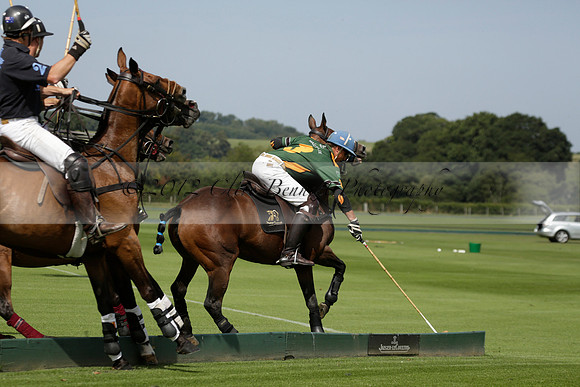 Maiz Dulce (green) v River (blue) in a Uber Polo Midsummer 12 goal polo match on Wednesday 21 August 2013 at Cowdray park Polo Club on Ambersham 2.  www.polopictures.co.uk