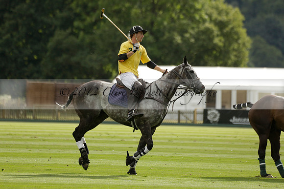 La Tremenda (lilac) v Maiz Dulce (yellow) in a Brecknock Cup polo match played on Lawns 1 at the Cowdray Park Polo Club on Tuesday 13 August 2013
