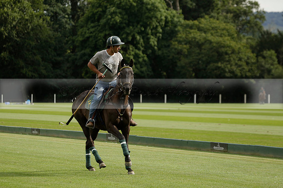 La Tremenda (lilac) v Maiz Dulce (yellow) in a Brecknock Cup polo match played on Lawns 1 at the Cowdray Park Polo Club on Tuesday 13 August 2013