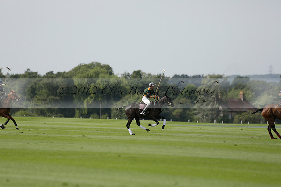 Maiz Dulce (green) v River (blue) in a Uber Polo Midsummer 12 goal polo match on Wednesday 21 August 2013 at Cowdray park Polo Club on Ambersham 2.  www.polopictures.co.uk