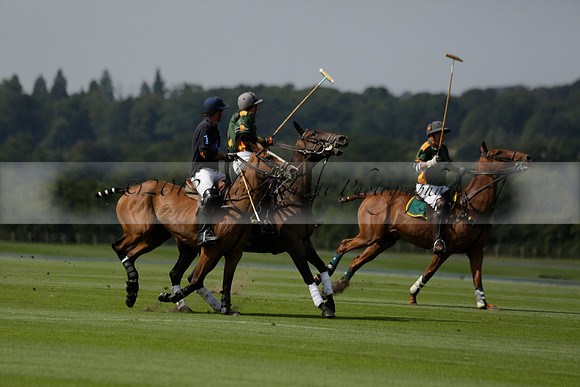 Maiz Dulce (green) v River (blue) in a Uber Polo Midsummer 12 goal polo match on Wednesday 21 August 2013 at Cowdray park Polo Club on Ambersham 2.  www.polopictures.co.uk