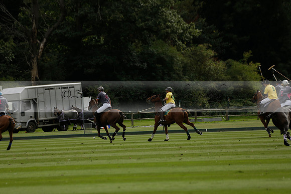 La Tremenda (lilac) v Maiz Dulce (yellow) in a Brecknock Cup polo match played on Lawns 1 at the Cowdray Park Polo Club on Tuesday 13 August 2013