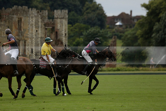 La Tremenda (lilac) v Maiz Dulce (yellow) in a Brecknock Cup polo match played on Lawns 1 at the Cowdray Park Polo Club on Tuesday 13 August 2013