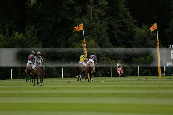 La Tremenda (lilac) v Maiz Dulce (yellow) in a Brecknock Cup polo match played on Lawns 1 at the Cowdray Park Polo Club on Tuesday 13 August 2013