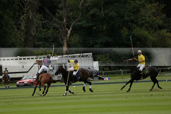 La Tremenda (lilac) v Maiz Dulce (yellow) in a Brecknock Cup polo match played on Lawns 1 at the Cowdray Park Polo Club on Tuesday 13 August 2013
