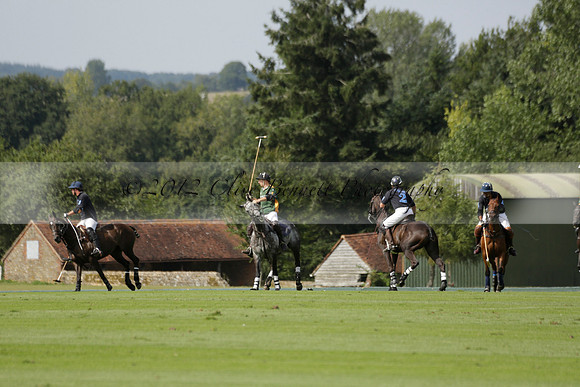 Maiz Dulce (green) v River (blue) in a Uber Polo Midsummer 12 goal polo match on Wednesday 21 August 2013 at Cowdray park Polo Club on Ambersham 2.  www.polopictures.co.uk