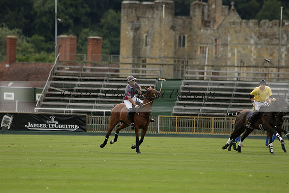 La Tremenda (lilac) v Maiz Dulce (yellow) in a Brecknock Cup polo match played on Lawns 1 at the Cowdray Park Polo Club on Tuesday 13 August 2013