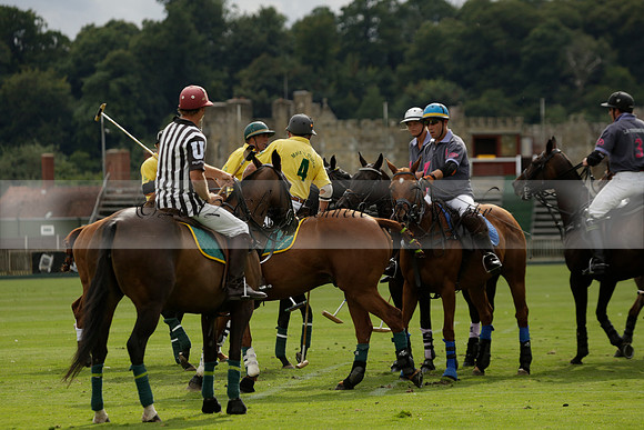 La Tremenda (lilac) v Maiz Dulce (yellow) in a Brecknock Cup polo match played on Lawns 1 at the Cowdray Park Polo Club on Tuesday 13 August 2013