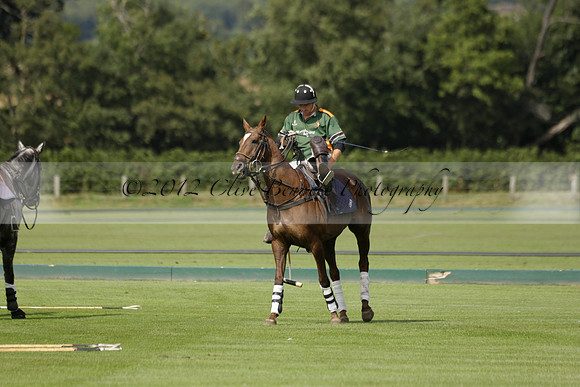 Maiz Dulce (green) v River (blue) in a Uber Polo Midsummer 12 goal polo match on Wednesday 21 August 2013 at Cowdray park Polo Club on Ambersham 2.  www.polopictures.co.uk