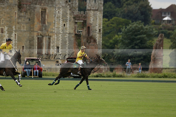 La Tremenda (lilac) v Maiz Dulce (yellow) in a Brecknock Cup polo match played on Lawns 1 at the Cowdray Park Polo Club on Tuesday 13 August 2013