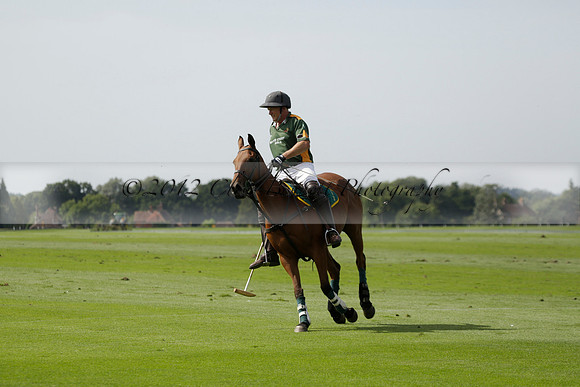 Maiz Dulce (green) v River (blue) in a Uber Polo Midsummer 12 goal polo match on Wednesday 21 August 2013 at Cowdray park Polo Club on Ambersham 2.  www.polopictures.co.uk