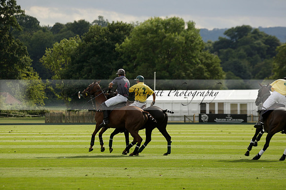La Tremenda (lilac) v Maiz Dulce (yellow) in a Brecknock Cup polo match played on Lawns 1 at the Cowdray Park Polo Club on Tuesday 13 August 2013