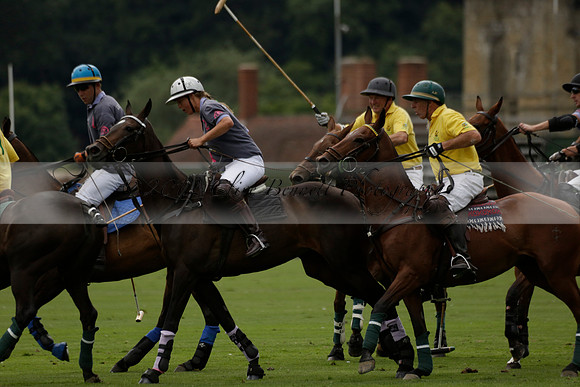 La Tremenda (lilac) v Maiz Dulce (yellow) in a Brecknock Cup polo match played on Lawns 1 at the Cowdray Park Polo Club on Tuesday 13 August 2013