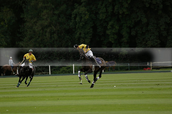La Tremenda (lilac) v Maiz Dulce (yellow) in a Brecknock Cup polo match played on Lawns 1 at the Cowdray Park Polo Club on Tuesday 13 August 2013