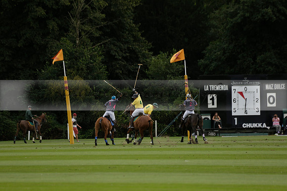 La Tremenda (lilac) v Maiz Dulce (yellow) in a Brecknock Cup polo match played on Lawns 1 at the Cowdray Park Polo Club on Tuesday 13 August 2013