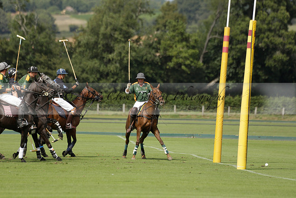 Maiz Dulce (green) v River (blue) in a Uber Polo Midsummer 12 goal polo match on Wednesday 21 August 2013 at Cowdray park Polo Club on Ambersham 2.  www.polopictures.co.uk