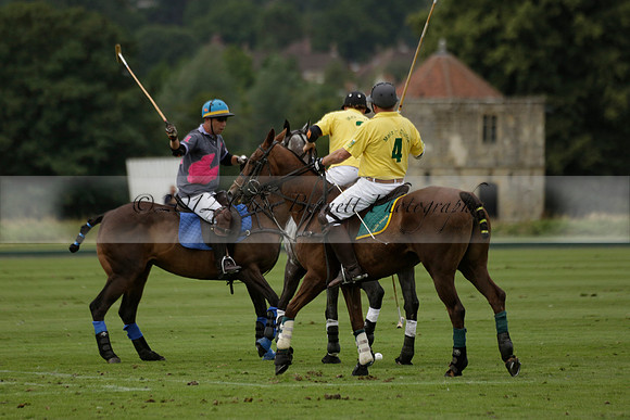 La Tremenda (lilac) v Maiz Dulce (yellow) in a Brecknock Cup polo match played on Lawns 1 at the Cowdray Park Polo Club on Tuesday 13 August 2013