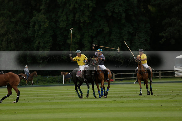 La Tremenda (lilac) v Maiz Dulce (yellow) in a Brecknock Cup polo match played on Lawns 1 at the Cowdray Park Polo Club on Tuesday 13 August 2013