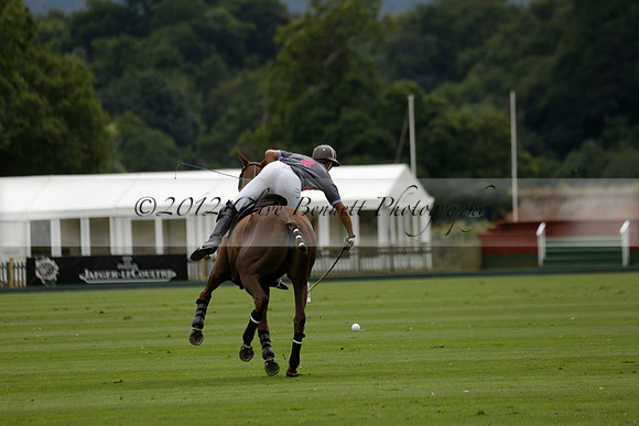 La Tremenda (lilac) v Maiz Dulce (yellow) in a Brecknock Cup polo match played on Lawns 1 at the Cowdray Park Polo Club on Tuesday 13 August 2013