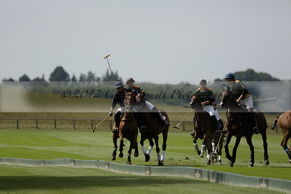 Maiz Dulce (green) v River (blue) in a Uber Polo Midsummer 12 goal polo match on Wednesday 21 August 2013 at Cowdray park Polo Club on Ambersham 2.  www.polopictures.co.uk